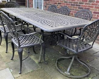 9-Piece Outdoor Wrought Iron Dining Table Set: Extension Table & 8 Chairs.