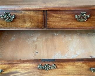 Antique Flame Mahogany Chest of Drawers with Brass Pulls & Bracket Feet. Circa 1750s. Measures 38” W x 20” D x 35” H. Photo 4 of 4.