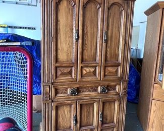 King size bed with Stearns and Foster mattress, two nightstands, ladies, dresser with mirror and armoire