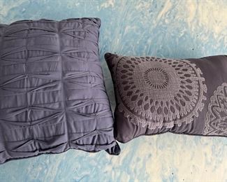 Two purplish blue pillows: large 17.5" square , small: 17.5" x 11. 