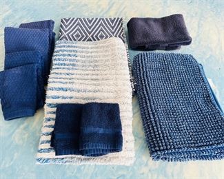 Blue and white rugs and towels 