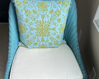 Blue wicker chair with pillow 