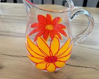 Clear acrylic vase with yellow and red flowers 10" tall 