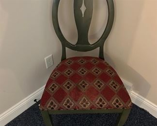 Green chair with red upholstered seat 