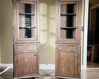 (2PC) PAIR RESTORATION HARDWARE DISPLAY CABINETS | A pair of solid wood Restoration Hardware "French Empire" cabinets, interior shelving, glazed doors and sides, drawers with locks (with keys!) - l. 15 x w. 23 x h. 72 in