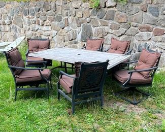 (7PC) PATIO TABLE & CHAIRS | Outdoor dining and lounge suite by Martha Stewart, black aluminum arm chairs with spring seats, cushions, and a white stone tile-top table. - l. 74 x w. 42 x h. 26 in