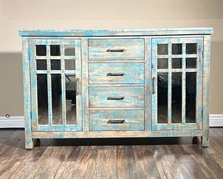 CABINET IN DISTRESSED BLUE FINISH | Wood cabinet with two mirrored cupboard doors each with one shelf, centering four drawers. - l. 56 x w. 16 x h. 35 in