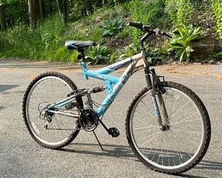 NEXT POWER CLIMBER FULL SUSPENSION BICYCLE
 | 18 speeds, with blue and silver paint.