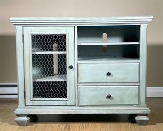 BROYHILL FURNITURE CONSOLE CABINET | Green side table/media stand, featuring 3 shelves behind chicken wire door, next to a bank of 2 drawers beneath 2 open shelves. - l. 34 x w. 18 x h. 34 in