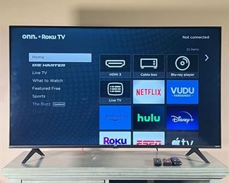 50 IN. ROKU TV WITH AMAZON FIRESTICK | Onn. TV - Model No. 100021258, 50’ flatscreen, Smart TV with Roku; with Amazon firestick included. All remotes included as well.