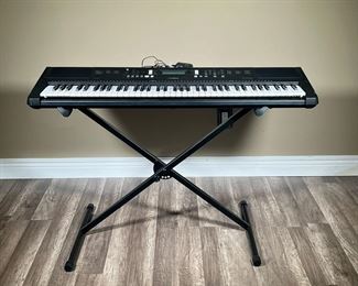 YAMAHA EW310 DIGITAL KEYBOARD | Yamaha PSR-EW310 Digital Keyboard or Electric Piano tested and functioning. Includes power cord and piano stand. - l. 44.5 x w. 14.25 x h. 38 in
