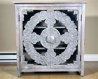 CARVED WOOD & GLASS CABINET | Carved gray washed wood and glass doors open to interior shelving. -  l. 16.25 x w. 37.25 x h. 38.5 in