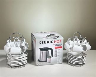 (3PC) KEURIG CARAFE AND ESPRESSO CUPS | Keurig Carafe for use with Keurig Plus series brewers. New in box Two sets of Imusa pottery espresso cups and saucers, each a set of 6; a total of 12 cups and 12 saucers. - h. 9.5 in (ea. rack)