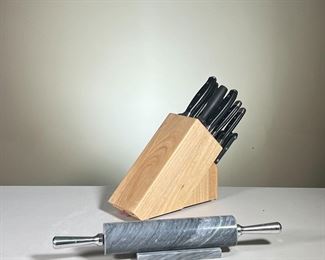 (2PC) HENCKELS KNIFE BLOCK & GRANITE ROLLING PIN | Including a J. A. Henckels knife block with misc. knives (4 Henckels knives [1 tip broken], a Calphalon, 3 Cuisinart, and 5 Henckels steak knives]; plus a grey granite rolling pin with stainless steel handles, and a granite stand. - l. 13” x w. 4.25” x h. 12.5” in (Knife Block with Knives)