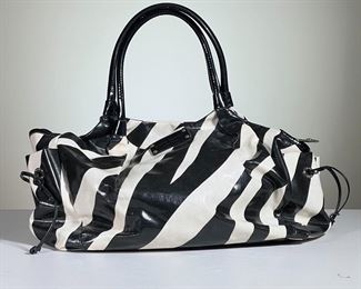 KATE SPADE BABY BAG | Black and white striped Kate Spade baby bag, lined with easy-to-clean material and several pockets, includes baby changing pad. - l. 19 x w. 8 x h. 10 in