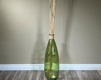 OVERSIZED DECORATIVE JAR | Large green glass jar with tall bamboo sticks sticking out the top. Bamboo approx. 83in. -  h. 32 x dia. 9 in (glass jar)