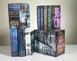 BOOK SETS; CASSANDRA CLARE & MORE | Includes: complete paperback box set of The Mortal Instruments, complete paperback box set of The Infernal Devices both by Cassandra Clare, and complete paperback collection of The Beautiful Creatures by Garcia Stohl. - l. 9.25 x w. 5.75 x h. 8.5 in