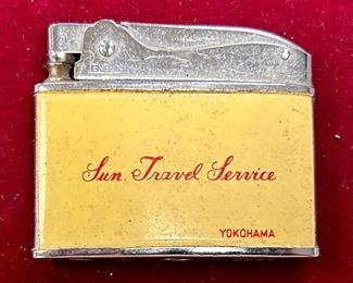 SST378 - Vintage Penguin Lighter with advertising for Sun Travel Service based in Yokohama, Japan