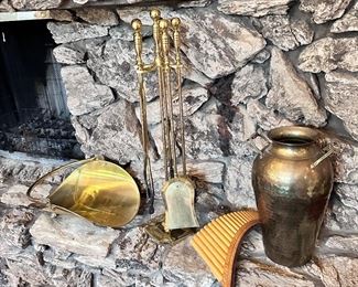 Brass fireplace tools and decor.