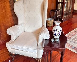 Carved leg wingback chair and set of nesting tables.