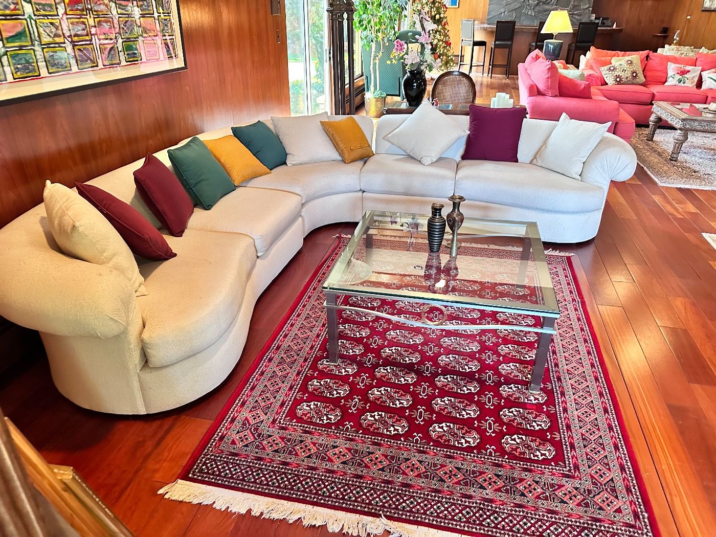 Scott Shuptrine sectional sofa, beautiful red area rug and metal and glass square coffee table.