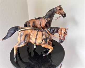 Pair of leather horses.