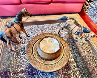 Large wood and glass coffee table, pair of leather horses.