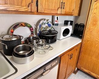 Additional cookware & smaller microwave.