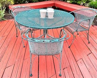 Woodard patio table & 3 barrel back chairs.