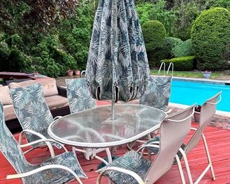 Umbrella table set with 4 stationary & 2 swivel chairs.