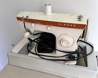 Vintage all metal Singer sewing machine in case.