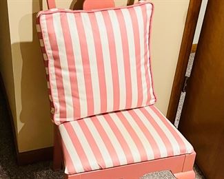 Rose striped seat upholstery in wooden chair with matching pillow 