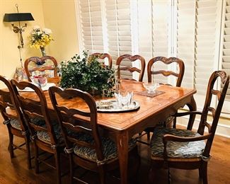 Dining set with 2 leaves (stored beneath) and 8 chairs. Two additional arm chairs also available