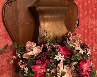 Brass design mounted on oak with floral decor. Very unusual and pretty!