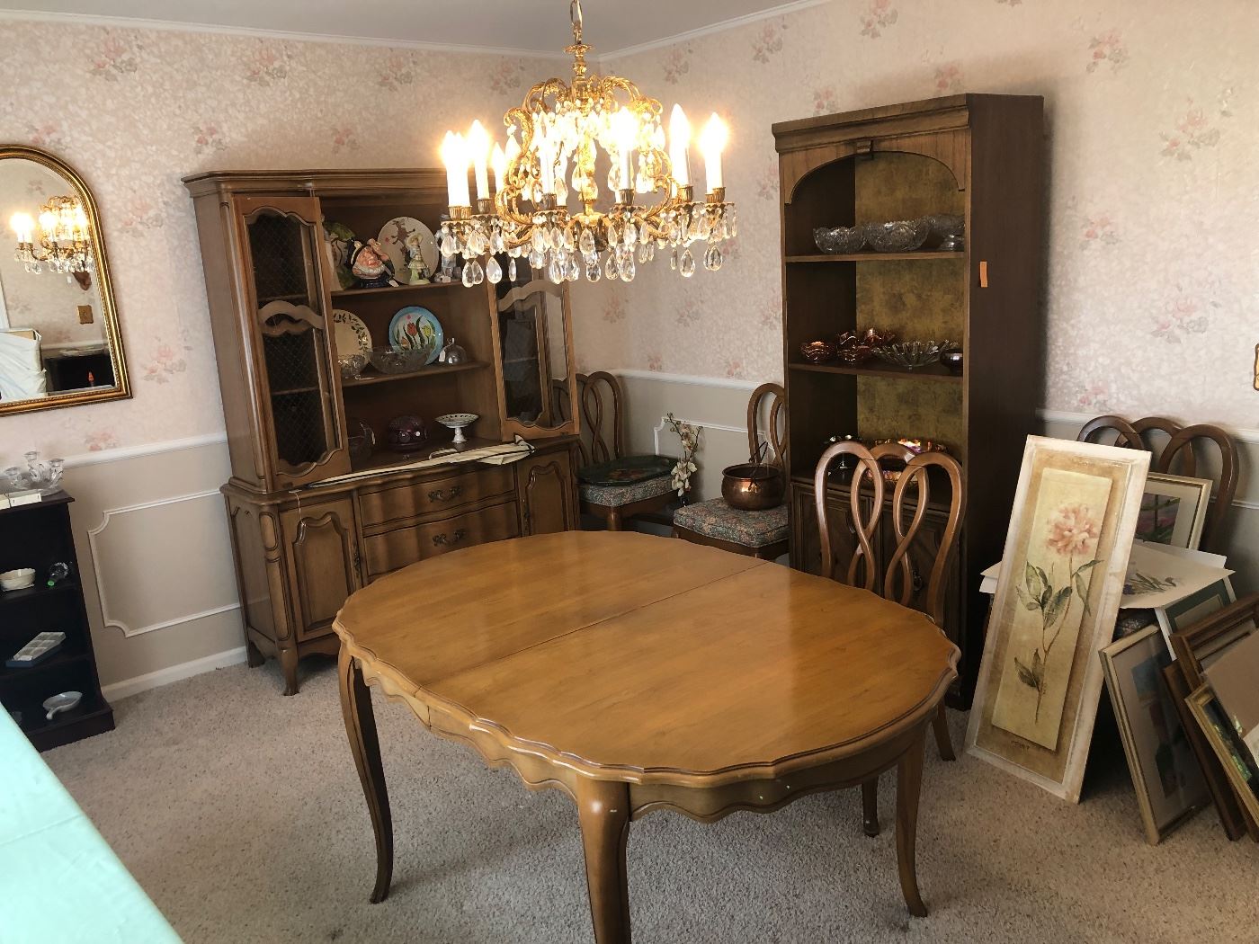 Dining room set (table, six chairs, china cabinet). This set is probably from the 1970s. I suppose you could call it "mid-century modern," but it is not the kind of set which is greatly desired by collectors. Still, it is a nice set.