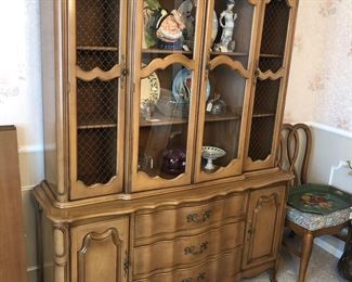 Excellent, large china cabinet. The inner doors have glass, the outer ones a metal screen with no glass.