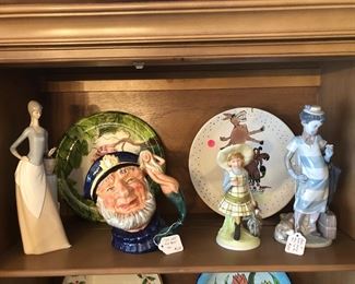 Figurines including Lladro "Black Legacy," large Toby mug by Royal Doulton. 