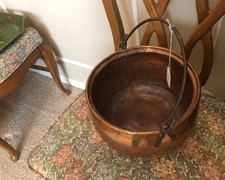 Copper pot with brass handle.