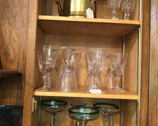 Several crystal and glass sets, including the great margarita sets on the bottom shelf. Also, the metal and porcelain teapot up top.