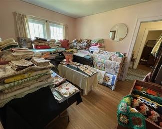 Linen room full of great quilts, afghans, tableclothes & napkins, and so much more