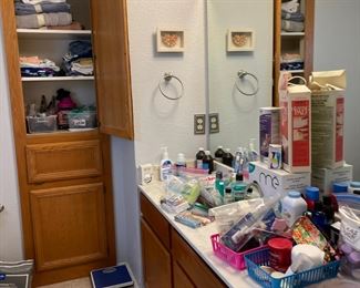 Bathroom full of lotions and potions, towels and bed linens