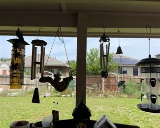 The back yard is full of bird feeders, wind chimes and so much more