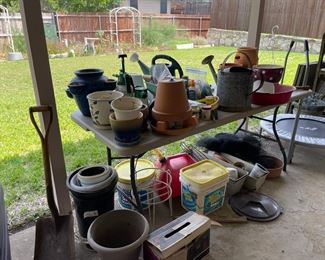 Lots of pots, planters, watering cans