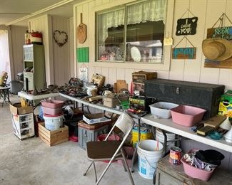 Lots of tools, signs and gardening items
