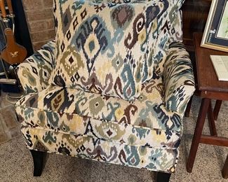 Upholstered arm chair with two cushions