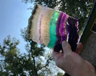 sliced fluorite held up to the light