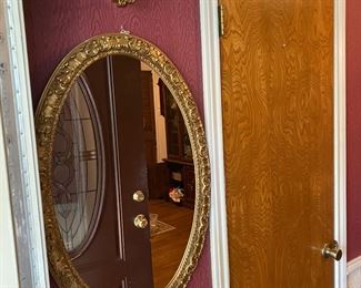 “Made to look antique” oval mirror