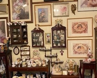 Victorian style floral paintings and prints with antiques full of China and ceramics