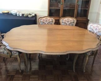 Dining table with 2 leaves. Measures 68inx26in folded, 68inx60in when extended