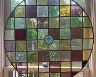 This beautiful stained glass piece measures 32" across.
